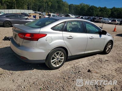 Trzecie zdjęcie samochodu z tyłu: 2016 FORD FOCUS SE VIN:1FADP3F26GL396957 - miniatura