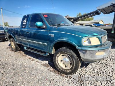 Czwarte zdjęcie samochodu z boku: 1998 FORD F150 VIN:1FTRX18LXWNA85562 - miniatura