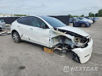 Czwarte zdjęcie samochodu z boku: 2023 TESLA MODEL Y VIN:7SAYGDEEXPF672883 - miniatura