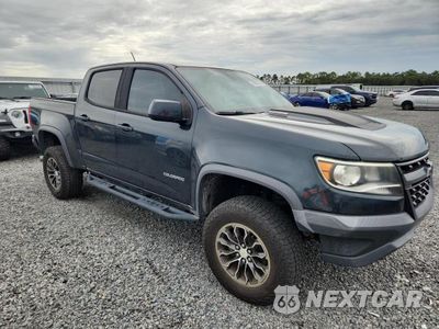 Czwarte zdjęcie samochodu z boku: 2018 CHEVROLET COLORADO ZR2 VIN:1GCPTEE14J1211167 - miniatura