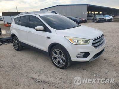 Czwarte zdjęcie samochodu z boku: 2017 FORD ESCAPE TITANIUM VIN:1FMCU0J94HUA45750 - miniatura