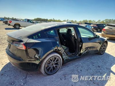 Trzecie zdjęcie samochodu z tyłu: 2022 TESLA MODEL 3 VIN:5YJ3E1EAXNF286647 - miniatura