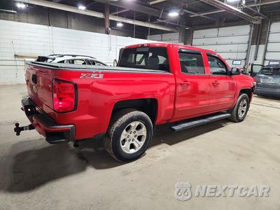 Trzecie zdjęcie samochodu z tyłu: 2016 CHEVROLET SILVERADO K1500 LT VIN:3GCUKREC1GG120950 - miniatura