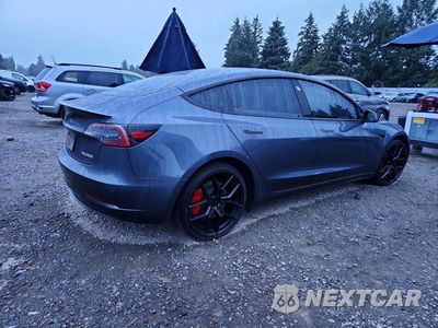 Trzecie zdjęcie samochodu z tyłu: 2023 TESLA MODEL 3 VIN:5YJ3E1EC2PF670491 - miniatura