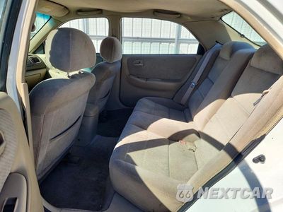 Zdjęcie 10 z 13 samochodu: 1998 MAZDA 626 DX VIN:1YVGF22C4W5735957 - miniatura