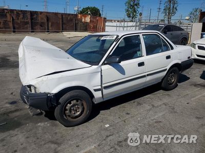 1990 TOYOTA COROLLA DELUXE 1NXAE94A3LZ104326 - główne zdjęcie licytacji z USA - miniatura