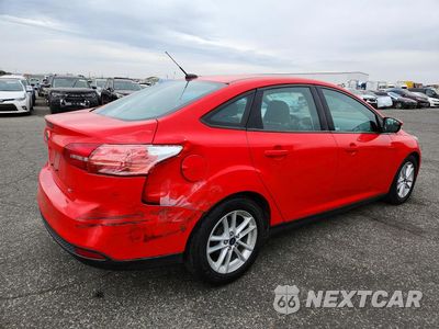 Trzecie zdjęcie samochodu z tyłu: 2016 FORD FOCUS SE VIN:1FADP3F28GL338381 - miniatura