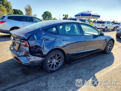 Trzecie zdjęcie samochodu z tyłu: 2023 TESLA MODEL 3 VIN:5YJ3E1EA5PF434092 - miniatura