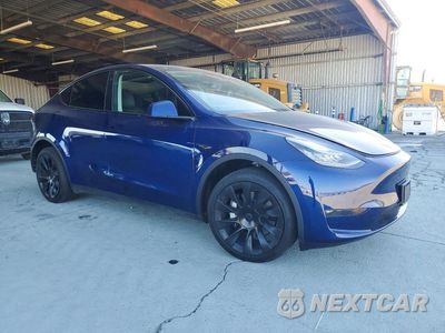 Czwarte zdjęcie samochodu z boku: 2023 TESLA MODEL Y VIN:7SAYGDEE8PF594586 - miniatura