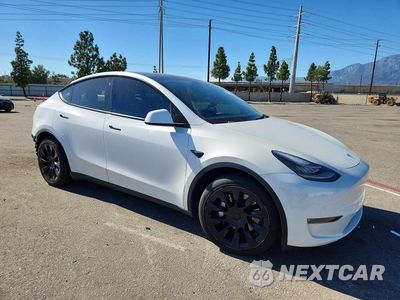 Czwarte zdjęcie samochodu z boku: 2021 TESLA MODEL Y VIN:5YJYGDEE9MF258969 - miniatura