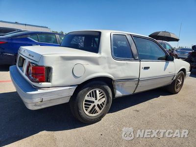 Trzecie zdjęcie samochodu z tyłu: 1987 PONTIAC GRAND AM LE VIN:1G2NV14U6HC939419 - miniatura