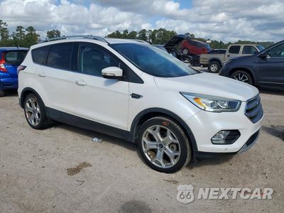 Czwarte zdjęcie samochodu z boku: 2017 FORD ESCAPE TITANIUM VIN:1FMCU0J99HUB73336 - miniatura