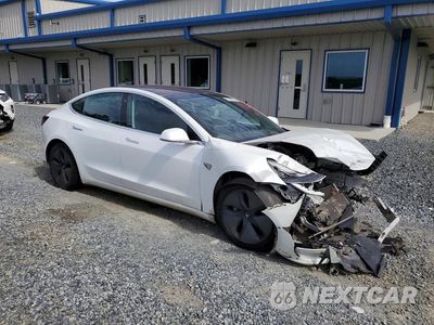 Czwarte zdjęcie samochodu z boku: 2018 TESLA MODEL 3 VIN:5YJ3E1EA1JF161692 - miniatura