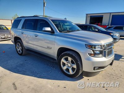 Czwarte zdjęcie samochodu z boku: 2019 CHEVROLET TAHOE C1500 LT VIN:1GNSCBKC8KR349304 - miniatura