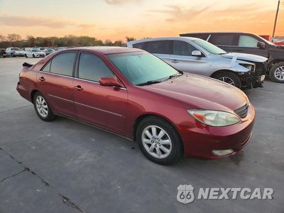 Czwarte zdjęcie samochodu z boku: 2003 TOYOTA CAMRY XLE V6 VIN:JTDBF30K730096059 - miniatura
