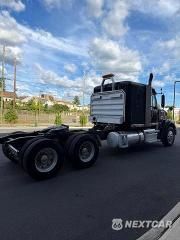 Czwarte zdjęcie samochodu z boku: 2015 FREIGHTLINER CORONADO SEMI TRUCK VIN:3AKJGND11FDGR4029 - miniatura
