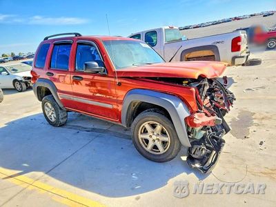 Czwarte zdjęcie samochodu z boku: 2002 JEEP LIBERTY SPORT VIN:1J4GK48K32W230289 - miniatura