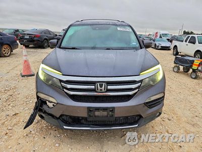Piąte zdjęcie samochodu w środku: 2017 HONDA PILOT TOURING VIN:5FNYF6H91HB013005 - miniatura
