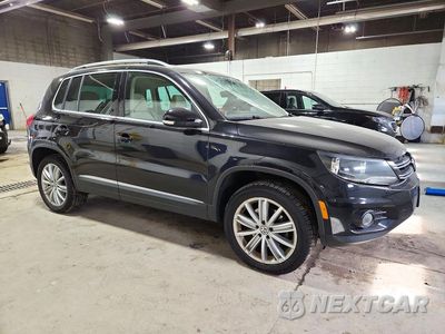 Czwarte zdjęcie samochodu z boku: 2014 VOLKSWAGEN TIGUAN S VIN:WVGBV3AX0EW606566 - miniatura