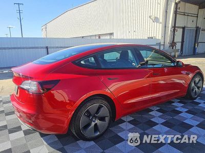 Trzecie zdjęcie samochodu z tyłu: 2022 TESLA MODEL 3 VIN:5YJ3E1EA5NF184799 - miniatura