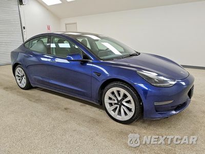 Czwarte zdjęcie samochodu z boku: 2022 TESLA MODEL 3 VIN:5YJ3E1EA0NF304220 - miniatura