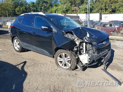 Czwarte zdjęcie samochodu z boku: 2012 HYUNDAI TUCSON GLS VIN:KM8JUCAC0CU509405 - miniatura