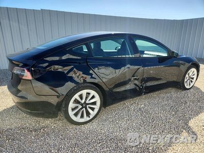 Trzecie zdjęcie samochodu z tyłu: 2022 TESLA MODEL 3 VIN:5YJ3E1EAXNF372413 - miniatura