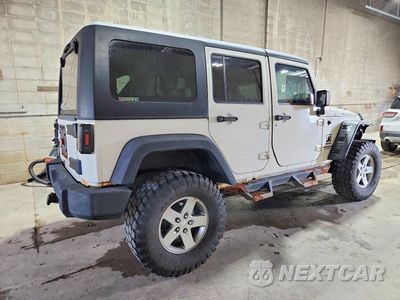 Trzecie zdjęcie samochodu z tyłu: 2010 JEEP WRANGLER UNLIMITED RUBICON VIN:1J4BA6H13AL111450 - miniatura