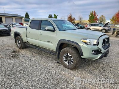 Czwarte zdjęcie samochodu z boku: 2022 TOYOTA TACOMA TRD OFF-ROAD VIN:3TMDZ5BN2NM129410 - miniatura