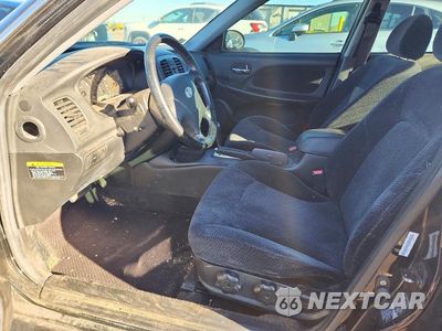 Zdjęcie 7 z 12 samochodu: 2002 HYUNDAI SONATA BASE VIN:KMHWF25HX2A666083 - miniatura