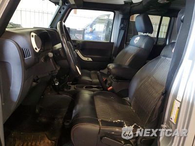 Zdjęcie 7 z 13 samochodu: 2012 JEEP WRANGLER UNLIMITED SAHARA VIN:1C4BJWEG5CL146900 - miniatura