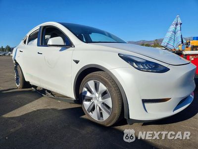 Czwarte zdjęcie samochodu z boku: 2023 TESLA MODEL Y VIN:7SAYGDEE6PA093399 - miniatura