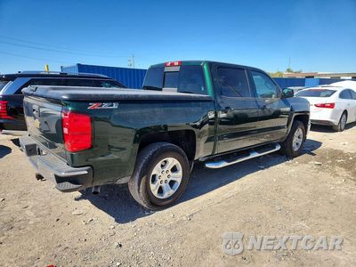 Trzecie zdjęcie samochodu z tyłu: 2015 CHEVROLET SILVERADO K1500 LT VIN:3GCUKREC1FG225423 - miniatura