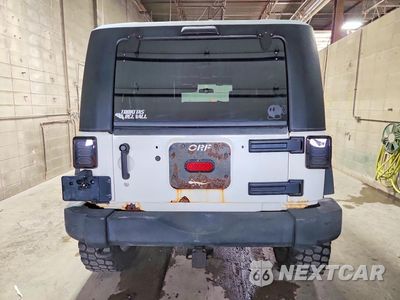Zdjęcie 6 z 13 samochodu: 2010 JEEP WRANGLER UNLIMITED RUBICON VIN:1J4BA6H13AL111450 - miniatura