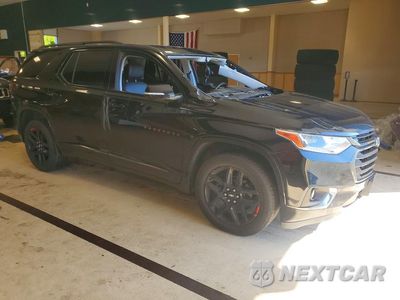 Czwarte zdjęcie samochodu z boku: 2018 CHEVROLET TRAVERSE PREMIER VIN:1GNEVJKW9JJ176997 - miniatura
