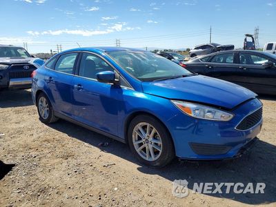 Czwarte zdjęcie samochodu z boku: 2018 FORD FOCUS SE VIN:1FADP3F27JL236321 - miniatura