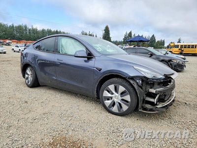 Czwarte zdjęcie samochodu z boku: 2023 TESLA MODEL Y VIN:7SAYGDEE2PA120856 - miniatura