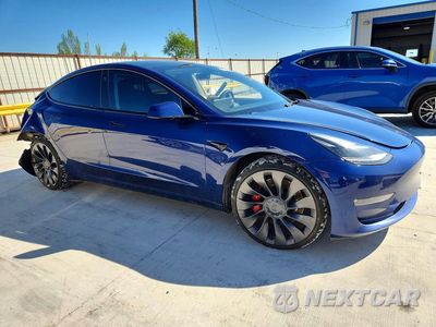 Czwarte zdjęcie samochodu z boku: 2023 TESLA MODEL 3 VIN:5YJ3E1EC1PF406811 - miniatura