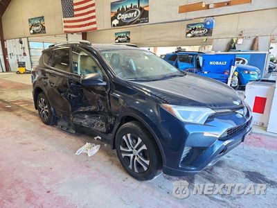 Czwarte zdjęcie samochodu z boku: 2017 TOYOTA RAV4 LE VIN:JTMBFREV0HJ174575 - miniatura