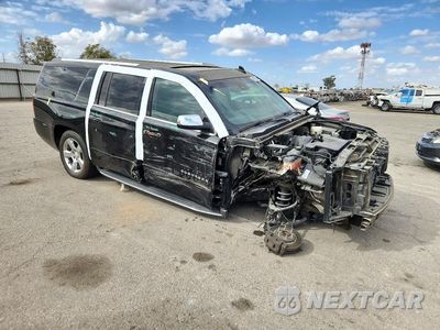 Czwarte zdjęcie samochodu z boku: 2017 CHEVROLET SUBURBAN C1500 PREMIER VIN:1GNSCJKC7HR156077 - miniatura