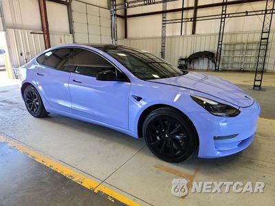 Czwarte zdjęcie samochodu z boku: 2023 TESLA MODEL 3 VIN:5YJ3E1EA3PF485106 - miniatura
