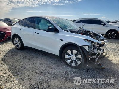 Czwarte zdjęcie samochodu z boku: 2022 TESLA MODEL Y VIN:7SAYGAEE3NF574791 - miniatura