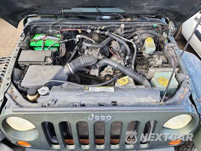 Zdjęcie 12 z 13 samochodu: 2007 JEEP WRANGLER SAHARA VIN:1J4GB59147L143196 - miniatura