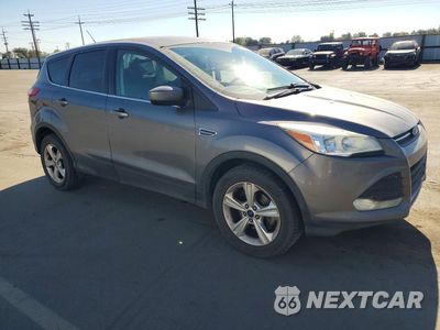 Czwarte zdjęcie samochodu z boku: 2014 FORD ESCAPE SE VIN:1FMCU0GX2EUE50734 - miniatura