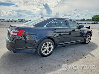 Trzecie zdjęcie samochodu z tyłu: 2016 FORD TAURUS SE VIN:1FAHP2D89GG140291 - miniatura