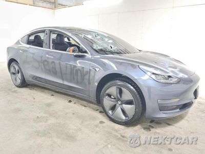 Czwarte zdjęcie samochodu z boku: 2019 TESLA MODEL 3 VIN:5YJ3E1EA4KF317175 - miniatura