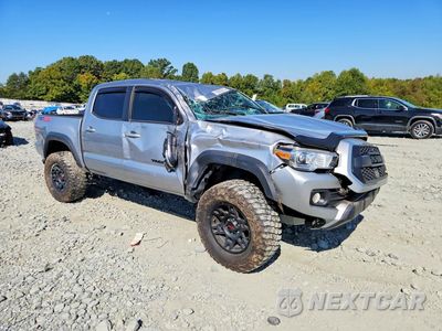 Czwarte zdjęcie samochodu z boku: 2023 TOYOTA TACOMA TRD OFF-ROAD VIN:3TMCZ5AN5PM637242 - miniatura
