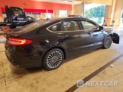 Trzecie zdjęcie samochodu z tyłu: 2017 FORD FUSION TITANIUM VIN:3FA6P0D94HR211007 - miniatura