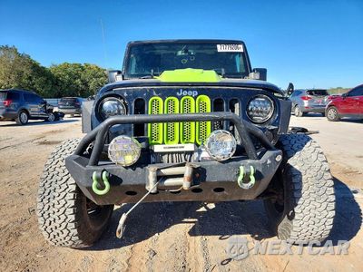 Piąte zdjęcie samochodu w środku: 2015 JEEP WRANGLER UNLIMITED SPORT VIN:1C4BJWDGXFL641633 - miniatura