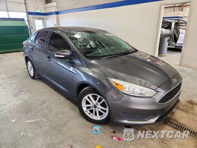 Czwarte zdjęcie samochodu z boku: 2016 FORD FOCUS SE VIN:1FADP3F21GL402809 - miniatura